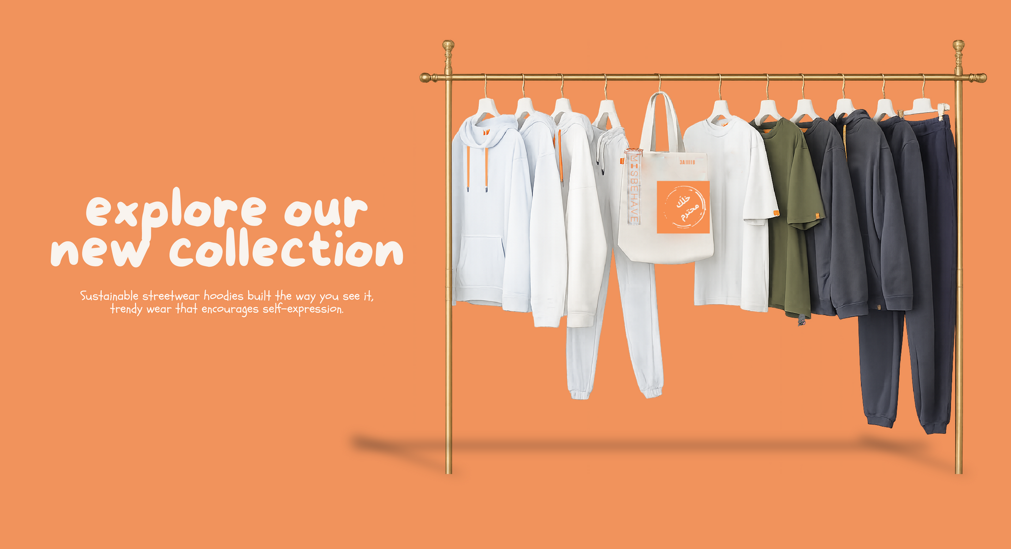 Clothing rack with shirts and a tote bag on an orange background with text 'explore our new collection'.